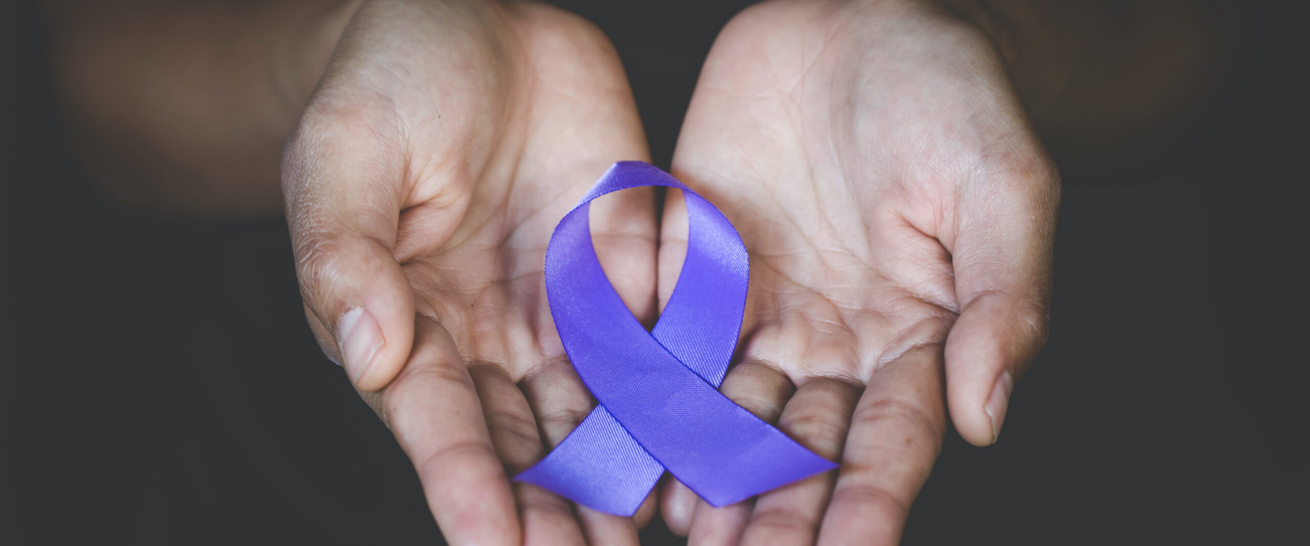 Hands holding Purple ribbons,  Pancreatic cancer